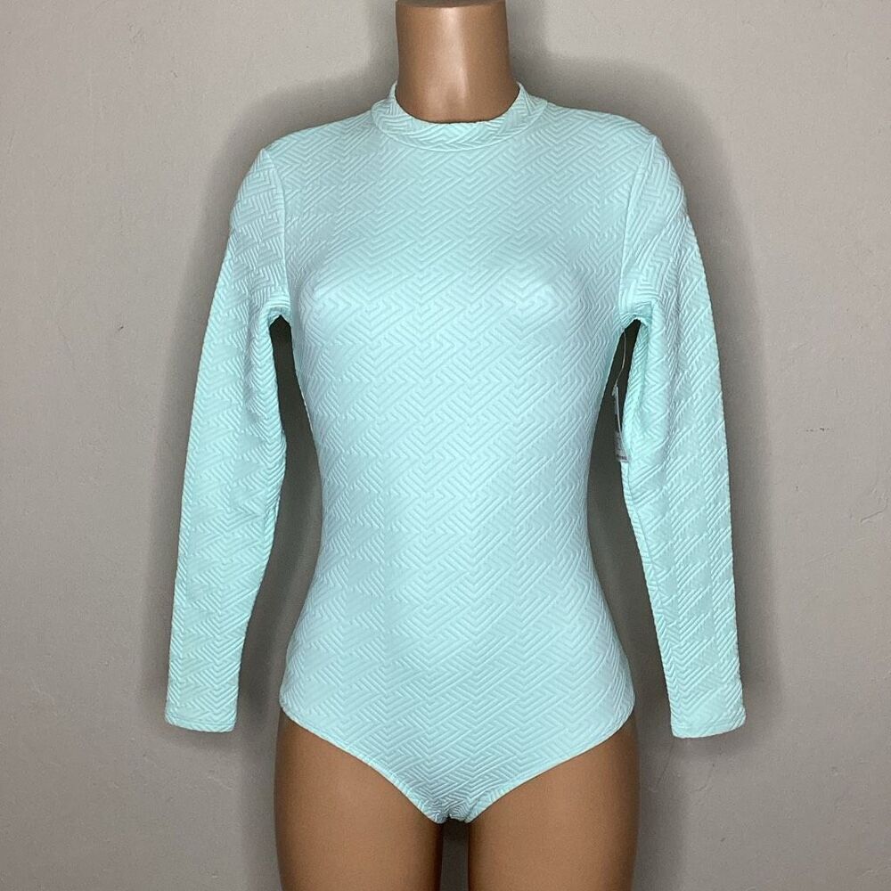 New. WET L.A. mint long sleeve rashguard. Medium. Retails $200